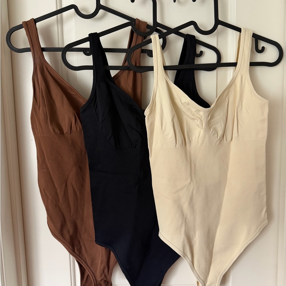 Set of Three OQQ Bodysuits in Black, Brown, and Cream